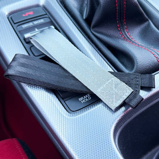 Gray and black woven STRIX keychain lanyards in matching seat belt material.